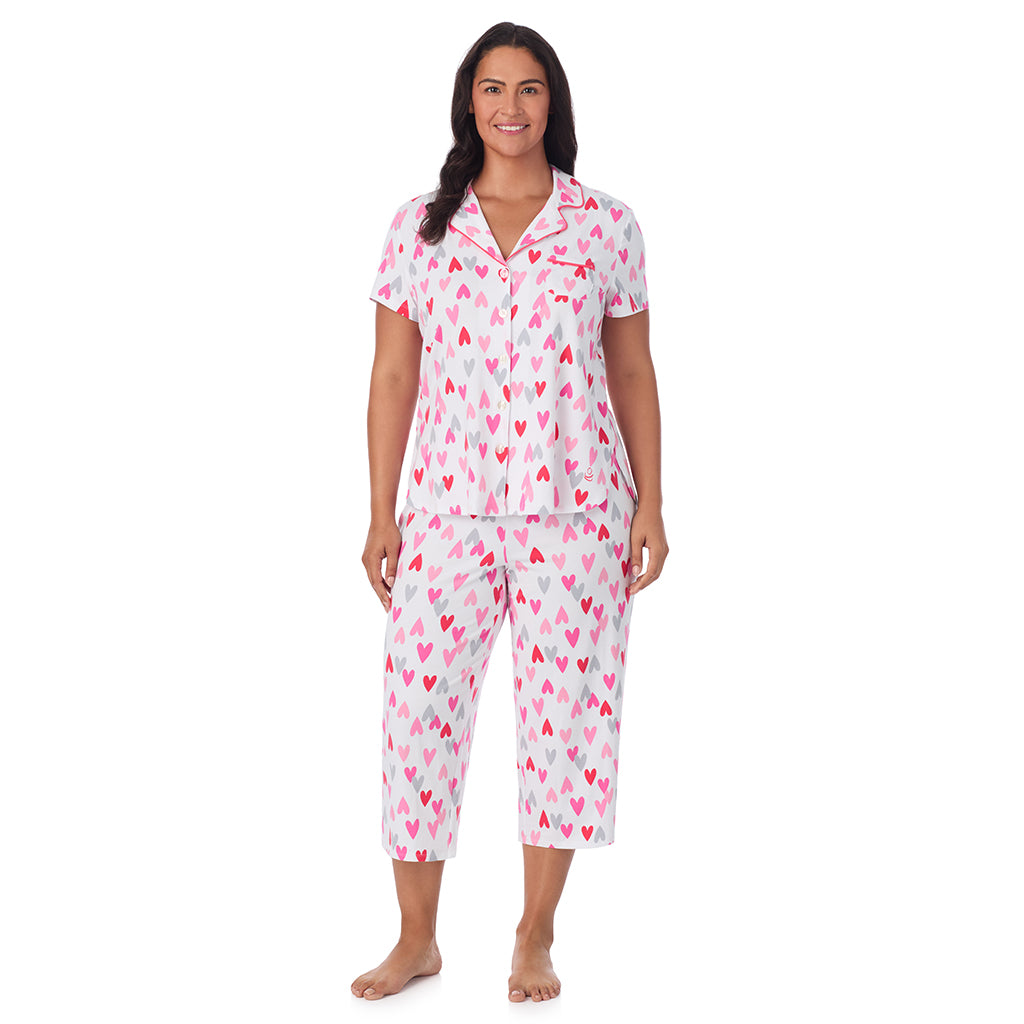 White Multi Heart;Model is wearing size 1X. She is 5'10", Bust 40", Waist 33", Hips 47".@A lady wearing Cotton Rich Short Sleeve Notch Collar Top with Cropped Pant Pajama Set PLUS
