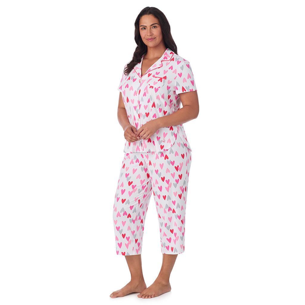 White Multi Heart;Model is wearing size 1X. She is 5'10", Bust 40", Waist 33", Hips 47".@A lady wearing Cotton Rich Short Sleeve Notch Collar Top with Cropped Pant Pajama Set PLUS