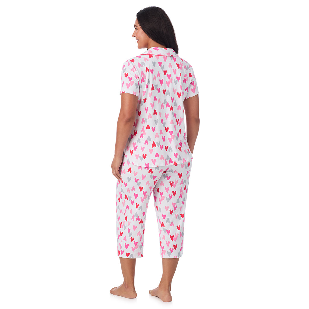 White Multi Heart;Model is wearing size 1X. She is 5'10", Bust 40", Waist 33", Hips 47".@A lady wearing Cotton Rich Short Sleeve Notch Collar Top with Cropped Pant Pajama Set PLUS