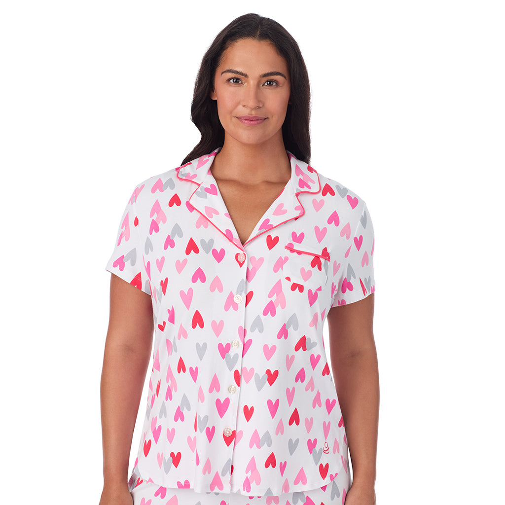 White Multi Heart;Model is wearing size 1X. She is 5'10", Bust 40", Waist 33", Hips 47".@A lady wearing Cotton Rich Short Sleeve Notch Collar Top with Cropped Pant Pajama Set PLUS