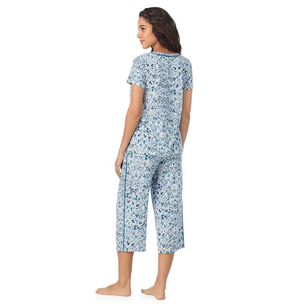 Woodland; Model is wearing size S. She is 5’9”, Bust 34”, Waist 23”, Hips 35”.@A lady wearing a Woodland Cotton Rich Short Sleeve Top with Cropped Pant Pajama Set