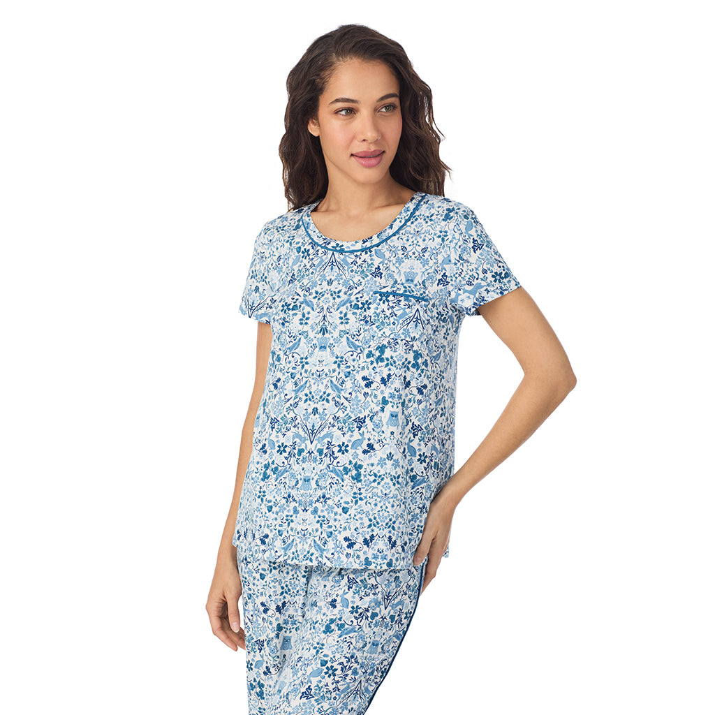 Woodland; Model is wearing size S. She is 5’9”, Bust 34”, Waist 23”, Hips 35”.@A lady wearing a Woodland Cotton Rich Short Sleeve Top with Cropped Pant Pajama Set