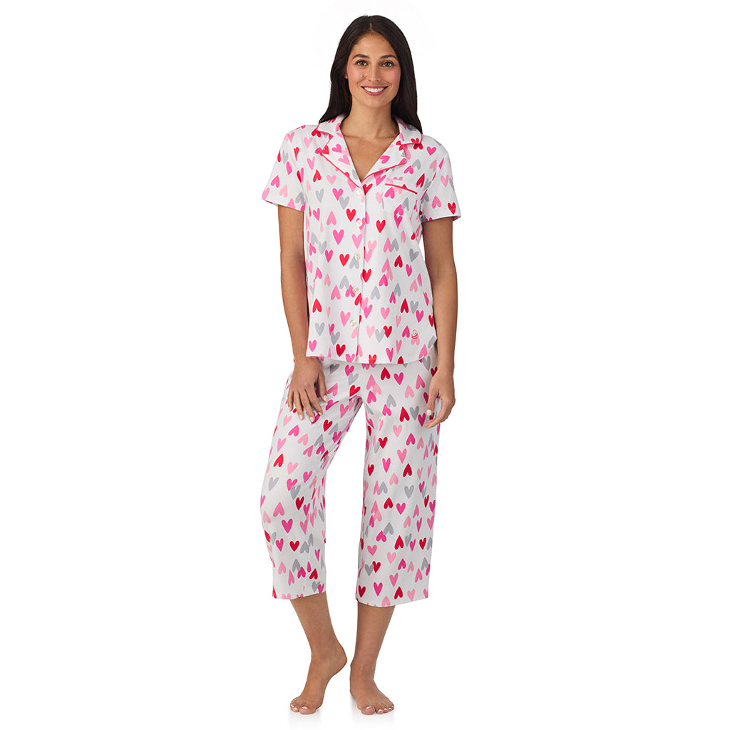 White Multi Heart;Model is wearing size S. She is 5'8.5", Bust 32", Waist 25", Hips 36".@A lady wearing Cotton Rich Short Sleeve Notch Collar Top with Cropped Pant Pajama Set