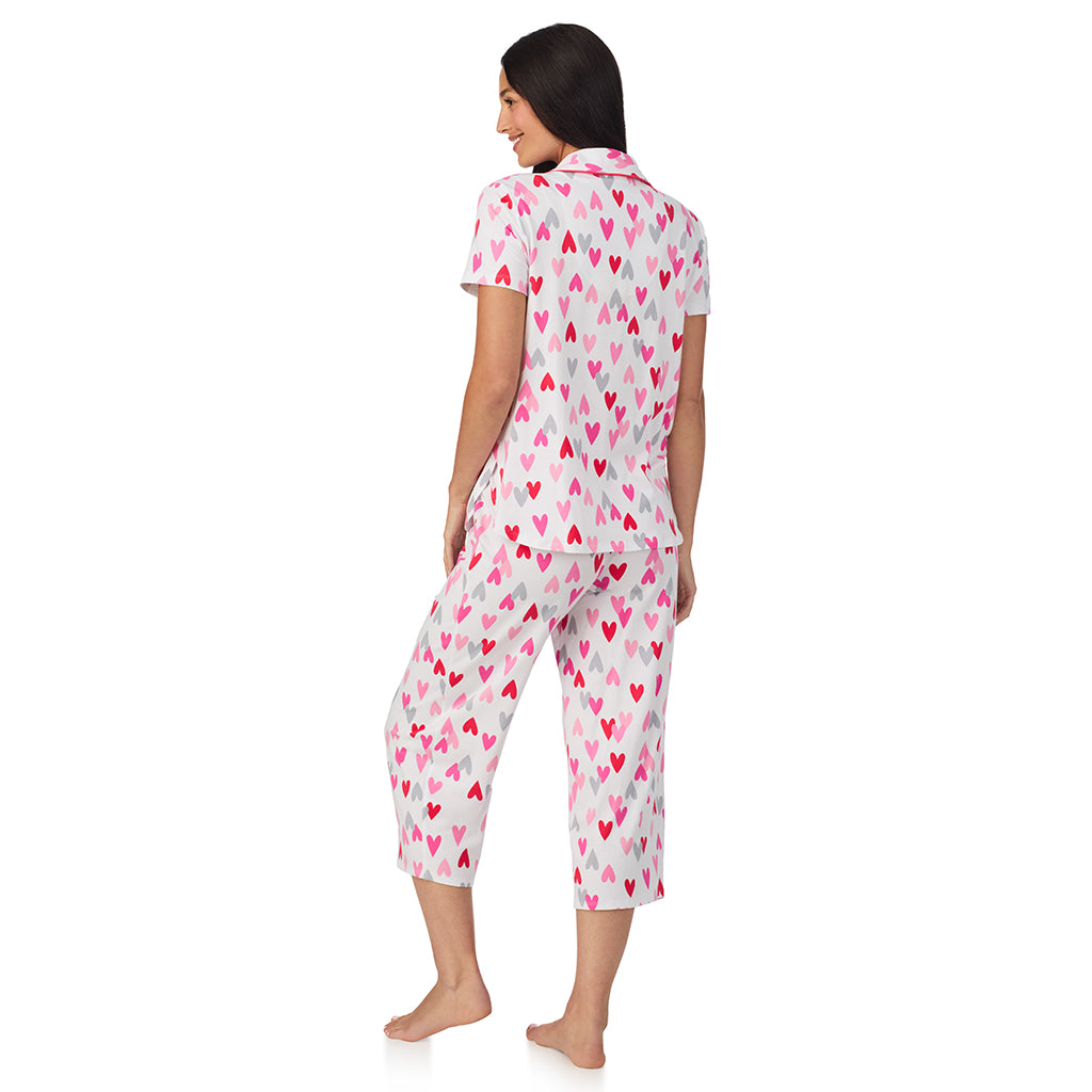 White Multi Heart;Model is wearing size S. She is 5'8.5", Bust 32", Waist 25", Hips 36".@A lady wearing Cotton Rich Short Sleeve Notch Collar Top with Cropped Pant Pajama Set