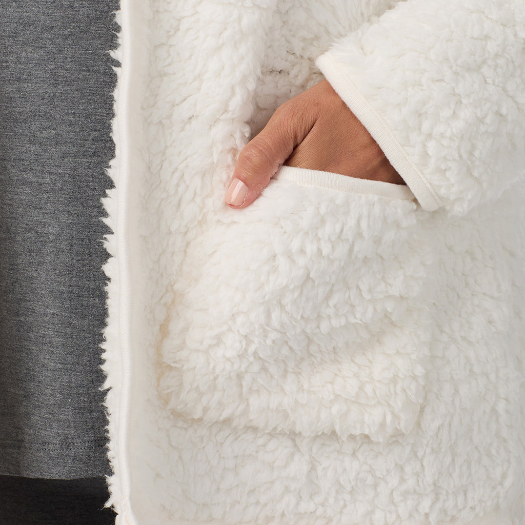 Cream; Model is wearing size S. She is 5'8", Bust 34", Waist 24.5", Hips 35".@A lady wearing Snuggle Up Sherpa Cardi