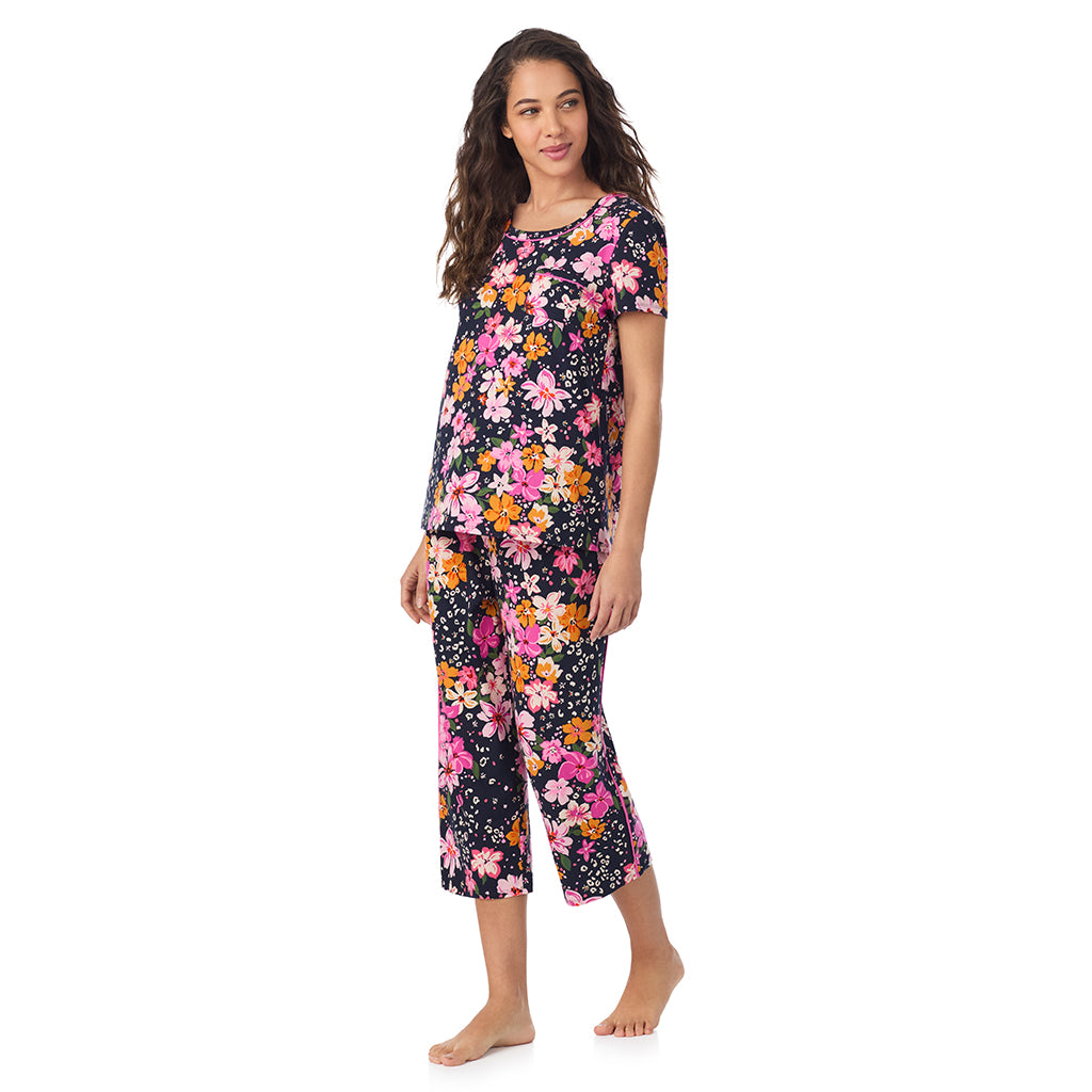 Big Floral; Model is wearing size S. She is 5’9”, Bust 34”, Waist 23”, Hips 35”.@A lady wearing a Big Floral Cotton Rich Short Sleeve Top with Cropped Pant Pajama Set