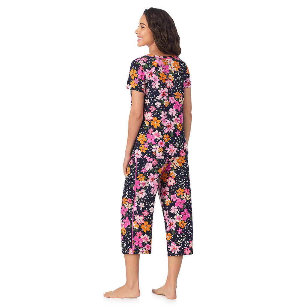Big Floral; Model is wearing size S. She is 5’9”, Bust 34”, Waist 23”, Hips 35”.@A lady wearing a Big Floral Cotton Rich Short Sleeve Top with Cropped Pant Pajama Set