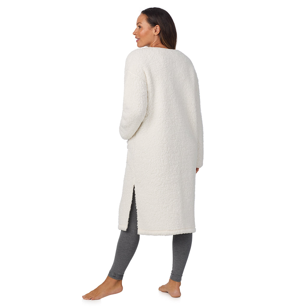 Cream; Model is wearing size S. She is 5'8", Bust 34", Waist 24.5", Hips 35".@A lady wearing Midi Sherpa Cardi