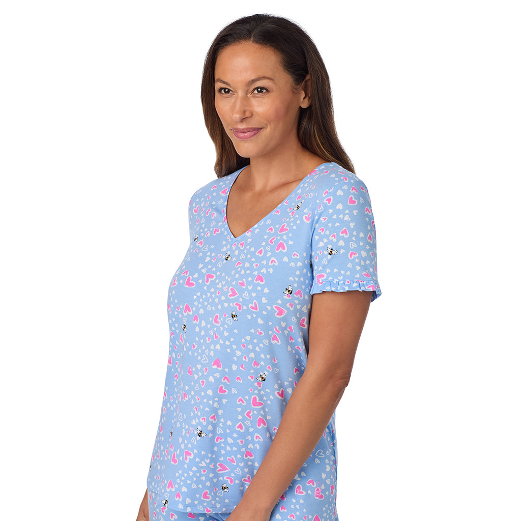 Blue Bee Heart; Model is wearing size S. She is 5'8", Bust 34", Waist 24.5", Hips 35".@A lady wearing Cotton Rich Ruffled Short Sleeve Top with Pant Pajama Set