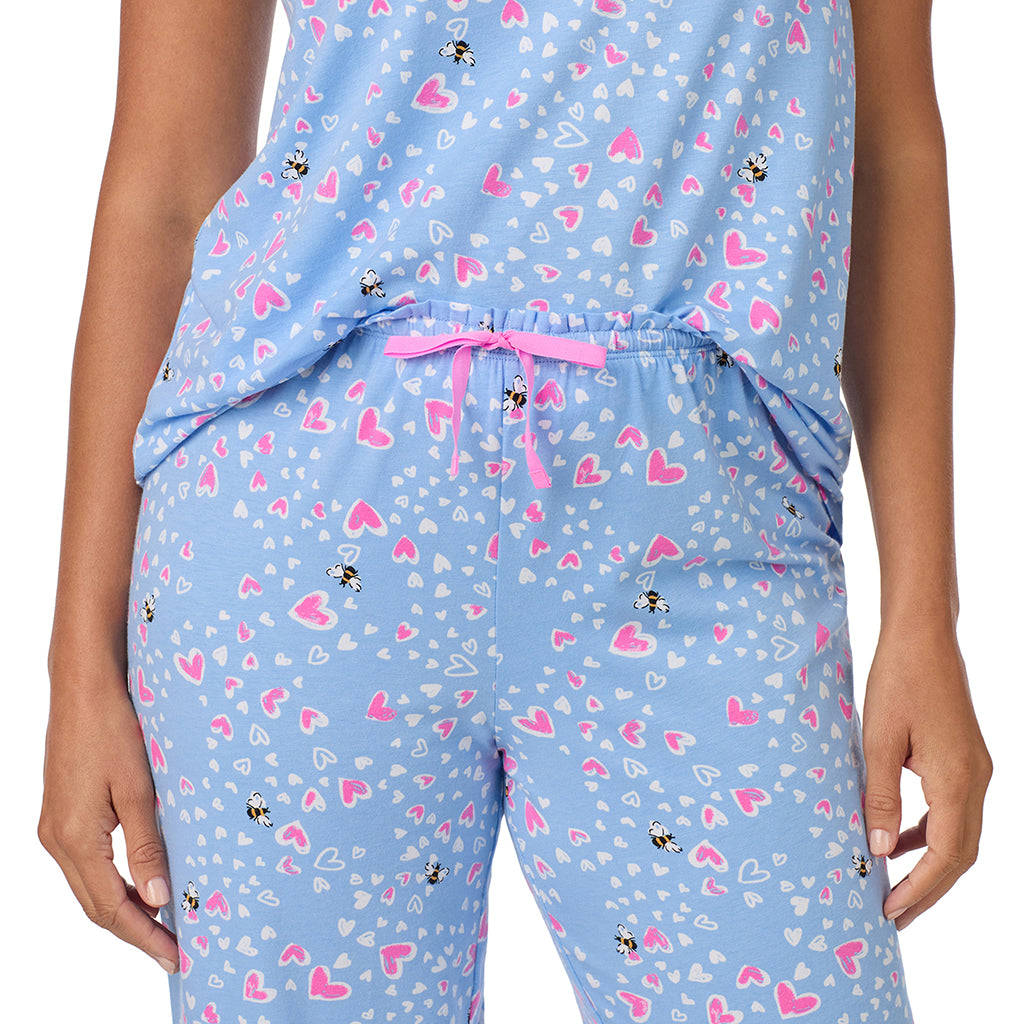 Blue Bee Heart; Model is wearing size S. She is 5'8", Bust 34", Waist 24.5", Hips 35".@A lady wearing Cotton Rich Ruffled Short Sleeve Top with Pant Pajama Set
