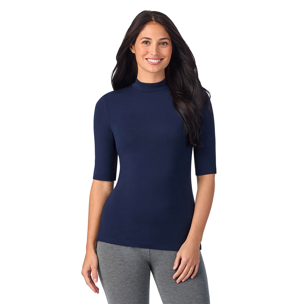Navy Blazer; Model is wearing size S. She is 5'8.5", Bust 32", Waist 25", Hips 36".@A lady wearing a blue elbow sleeve mock neck.