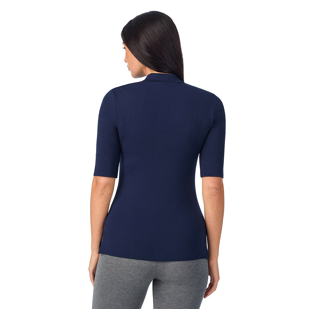 Navy Blazer; Model is wearing size S. She is 5'8.5", Bust 32", Waist 25", Hips 36".@A lady wearing a blue elbow sleeve mock neck.