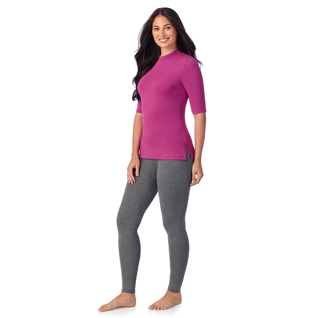 Baton Rouge; Model is wearing size S. She is 5'8.5", Bust 32", Waist 25", Hips 36".@A lady wearing a pink elbow sleeve mock neck.