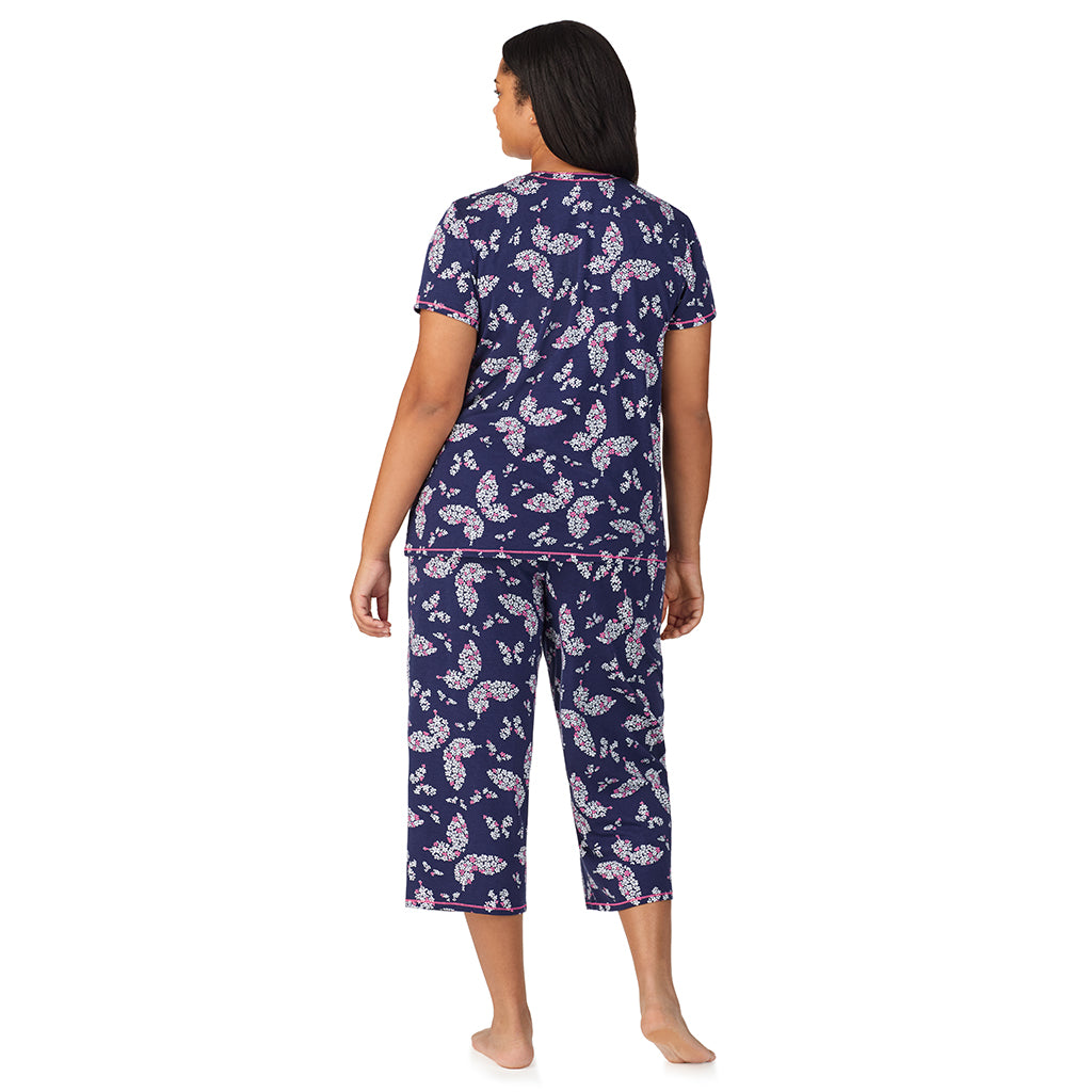 Navy Butterfly Floral; Model is wearing size 1X. She is 5'11", Bust 36", Waist 36.5", Hips 47.5". @A lady wearing Cotton-Blend Short Sleeve Top with Cropped Pant 2-Pc Pajama Set PLUS