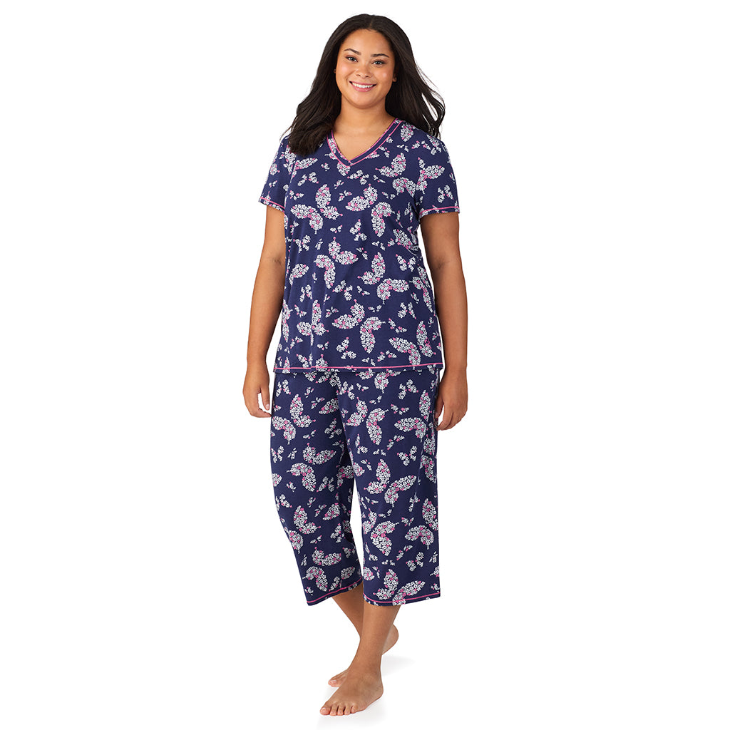 Navy Butterfly Floral; Model is wearing size 1X. She is 5'11", Bust 36", Waist 36.5", Hips 47.5". @A lady wearing Cotton-Blend Short Sleeve Top with Cropped Pant 2-Pc Pajama Set PLUS