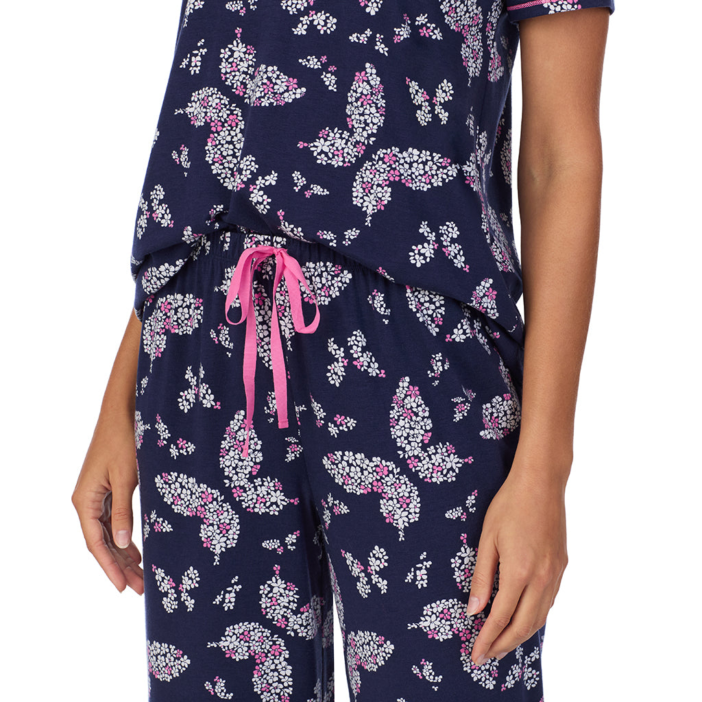 Navy Butterfly Floral; Model is wearing size S. She is 5’9”, Bust 34”, Waist 23”, Hips 35”. @A lady wearing Cotton-Blend Short Sleeve Top with Cropped Pant 2-Pc Pajama Set