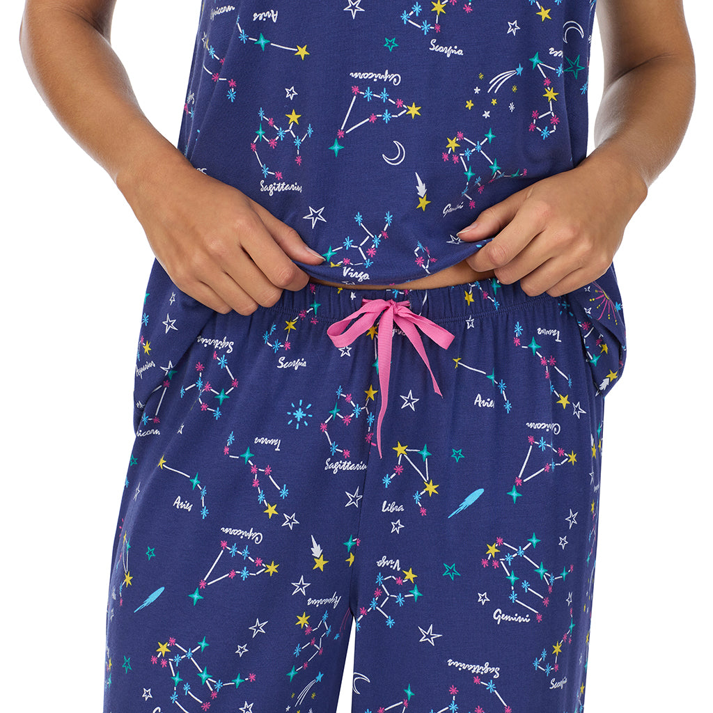 Blue Zodiac; Model is wearing size S. She is 5’9”, Bust 34”, Waist 23”, Hips 35”.@A lady wearing Cotton-Blend Short Sleeve Top with Cropped Pant 2-Pc Pajama Set