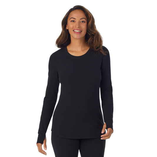 A lady wearing black cottonwear long sleeve scoop neck