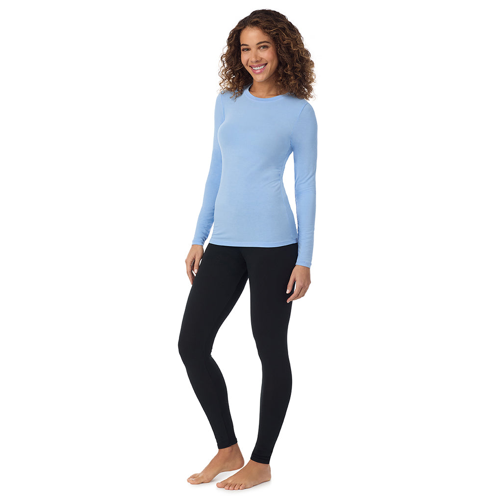 Vista Blue; Model is wearing size S. She is 5’9”, Bust 34”, Waist 23”, Hips 35”. @A lady wearing vista blue longsleeve crew.