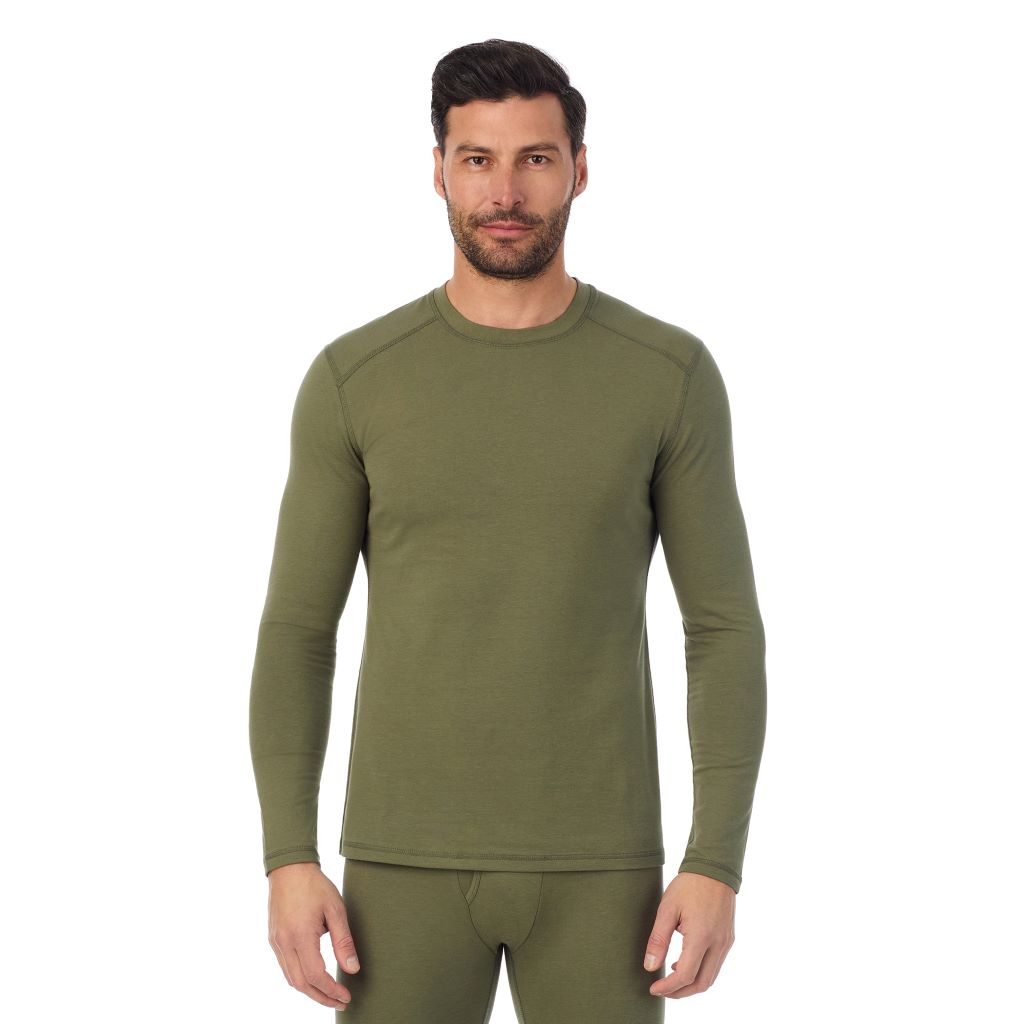A man wearing a army green long sleeve crew