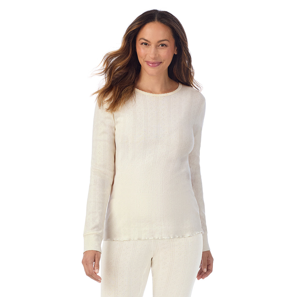 Ivory;Model is wearing size S. She is 5'8", Bust 34", Waist 24.5", Hips 35".@A lady is wearing Cotton Pointelle Long Sleeve Crew