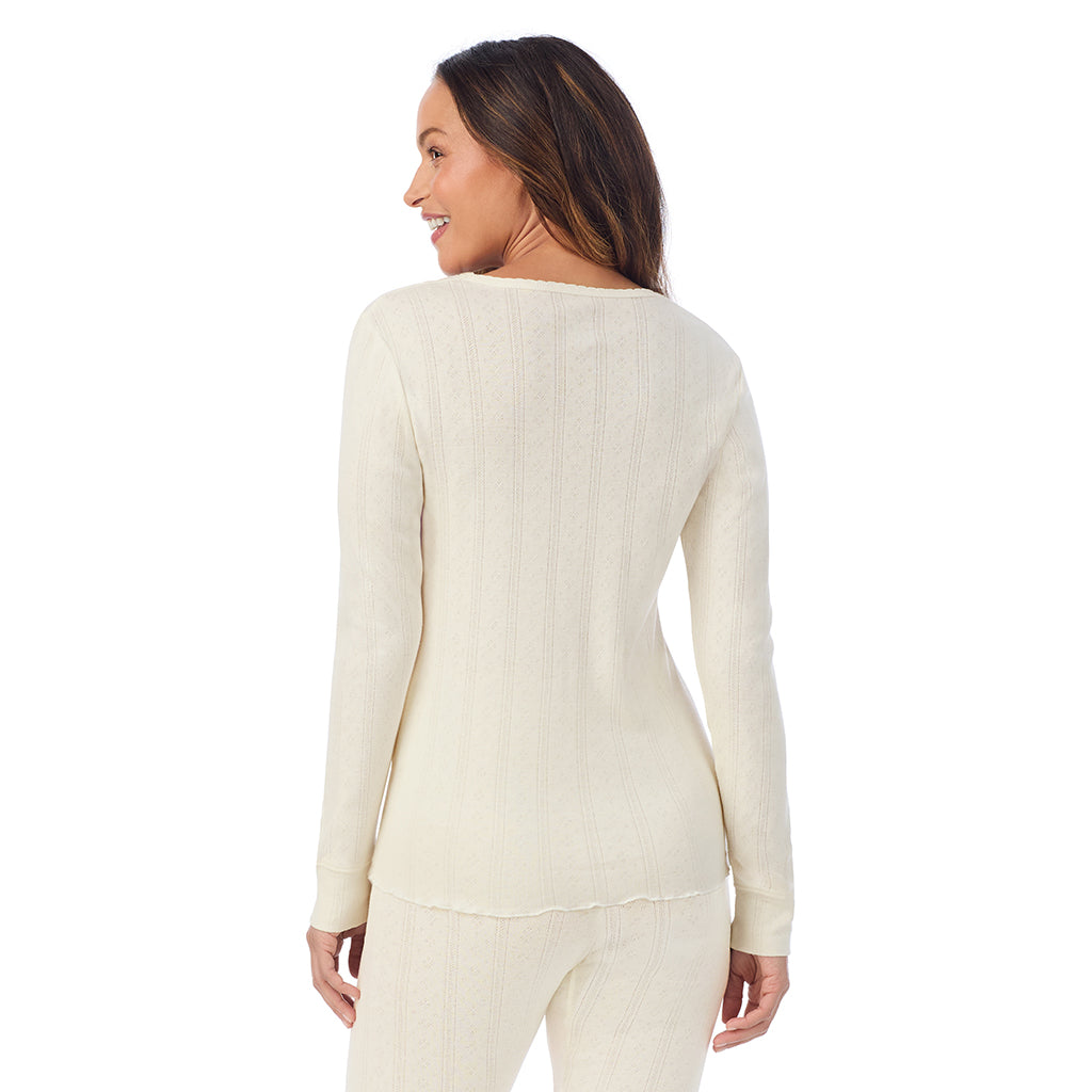 A lady is wearing Cotton Pointelle Long Sleeve Crew