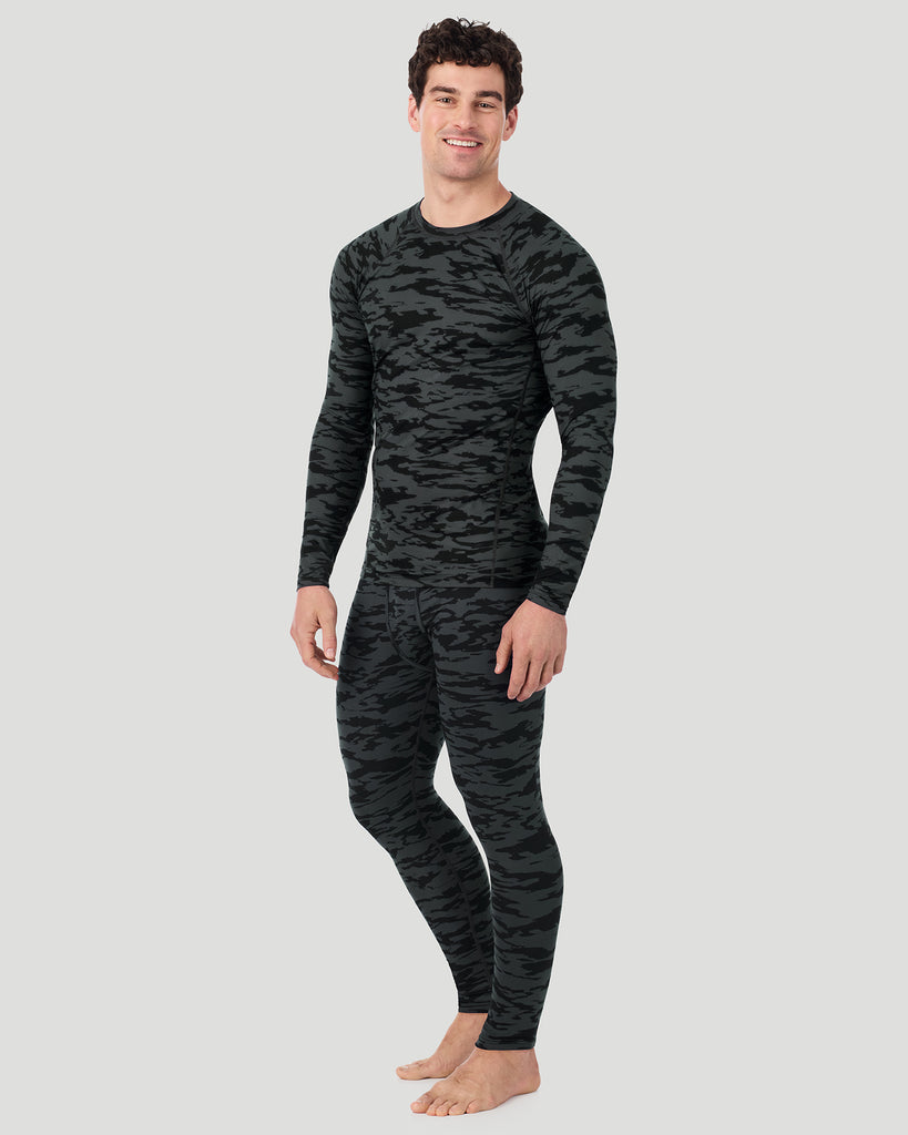 A man wearing Black Print ClimateSport Long Sleeve Crew in a front view standing pose