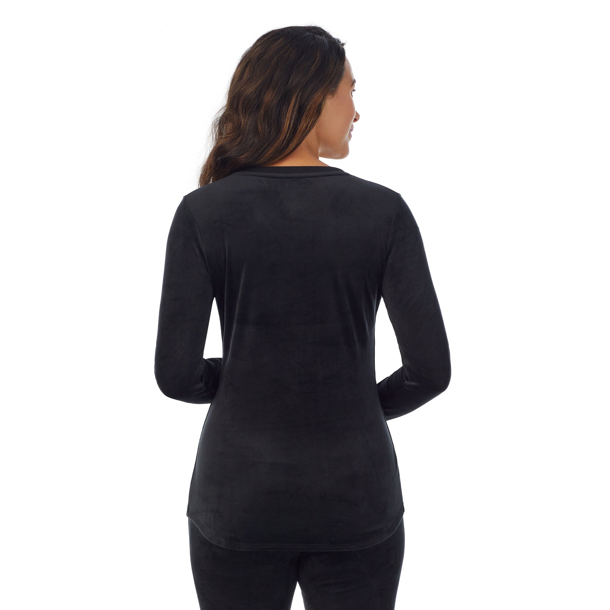 A lady wearing black stretch velour long sleeve v-neck