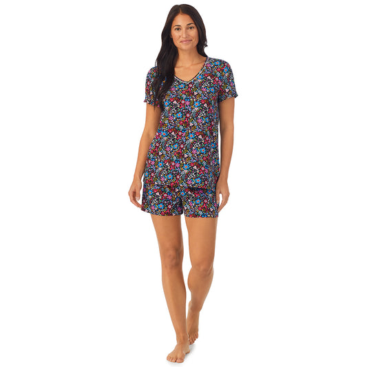  A lady wearing short sleeve top with boxer short pajama set with floral print