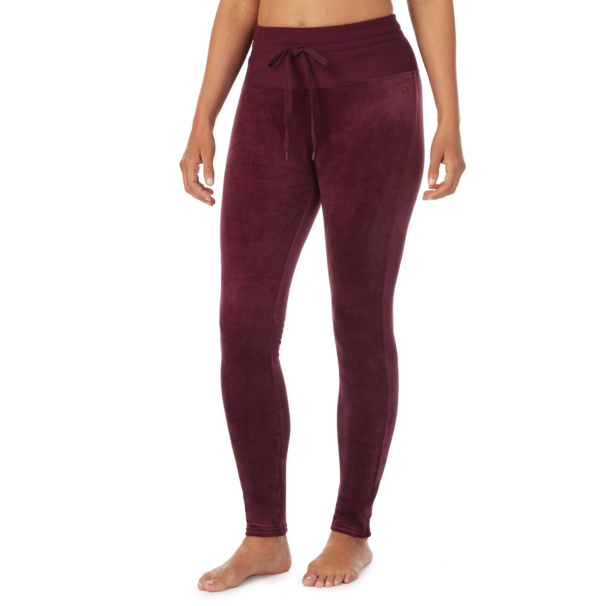 A lady wearing purple beet stretch velour legging