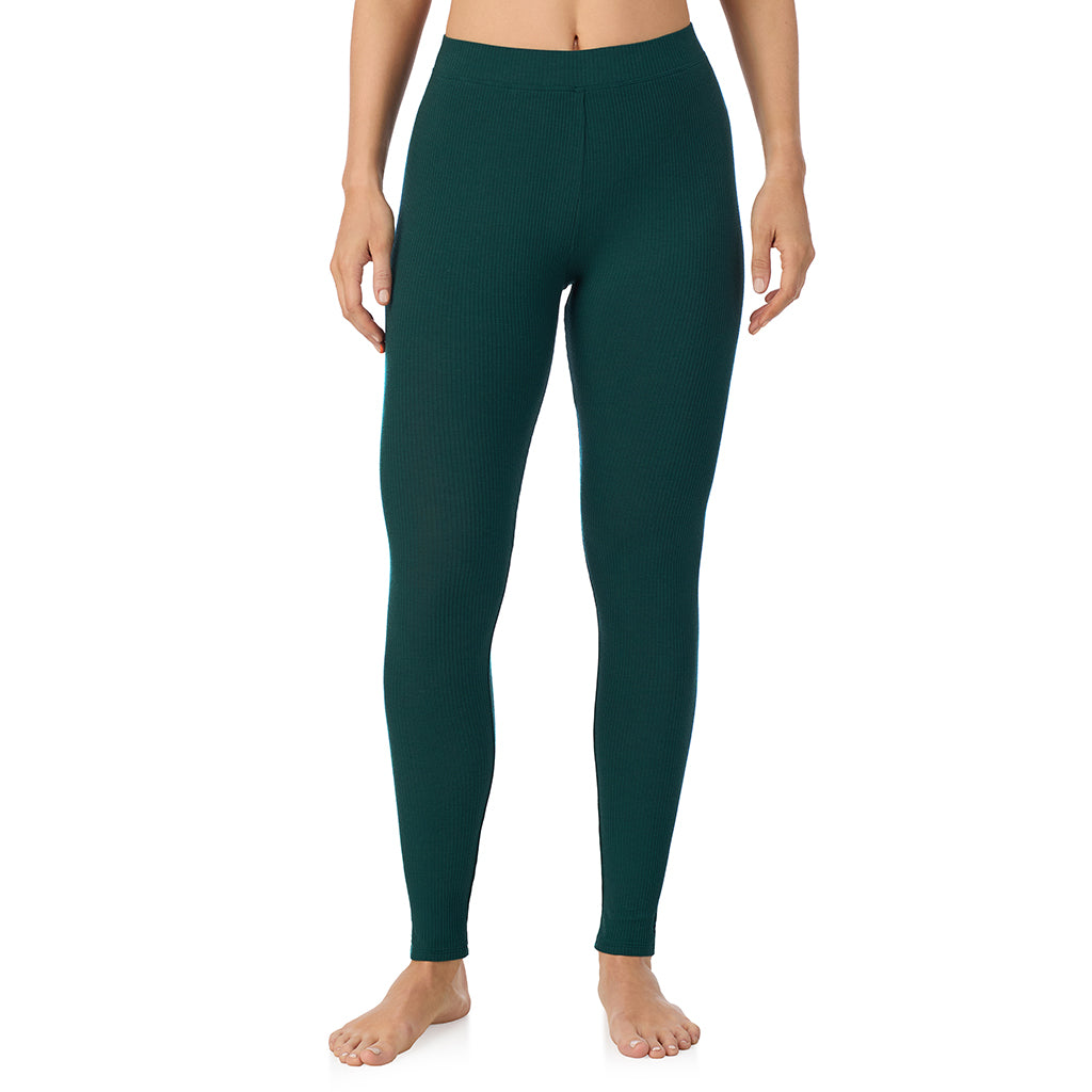 Dark Pine; Model is wearing size S. She is 5'11.5", Bust 34", Waist 26", Hips 37".@ A lady is wearing a Dark Pine Stretch Rib Legging