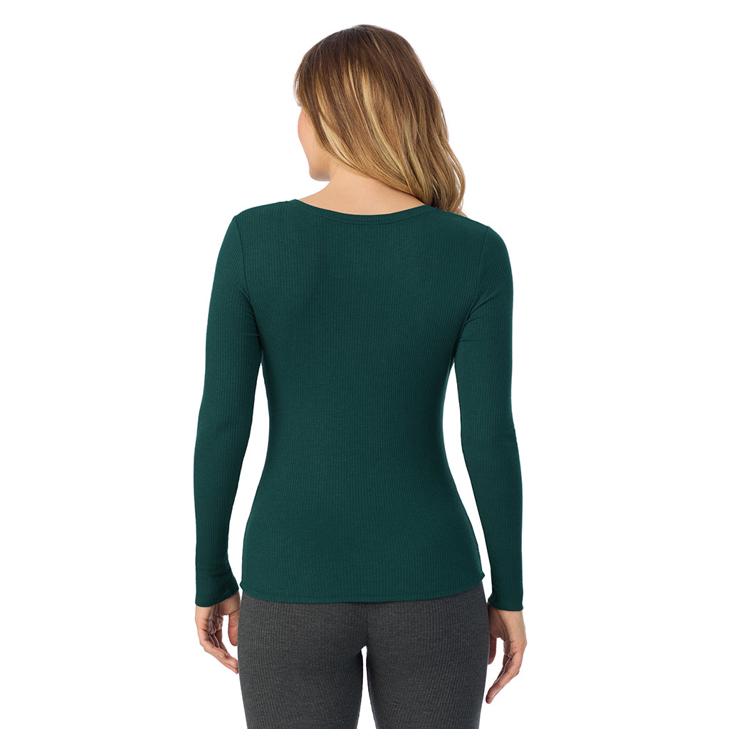Dark Pine; Model is wearing size S. She is 5'11.5", Bust 34", Waist 26", Hips 37".@ A lady is wearing a Dark Pine Stretch Rib Long Sleeve Henley