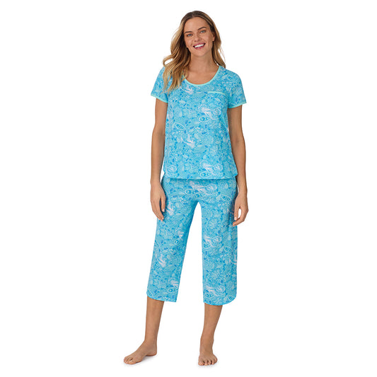  A lady wearing blue short sleeve top with cropped pant pajama set with mermaid floral print