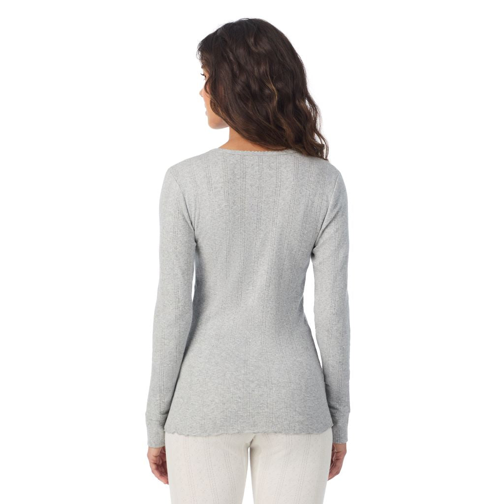 A lady is wearing Cotton Pointelle Long Sleeve Henley