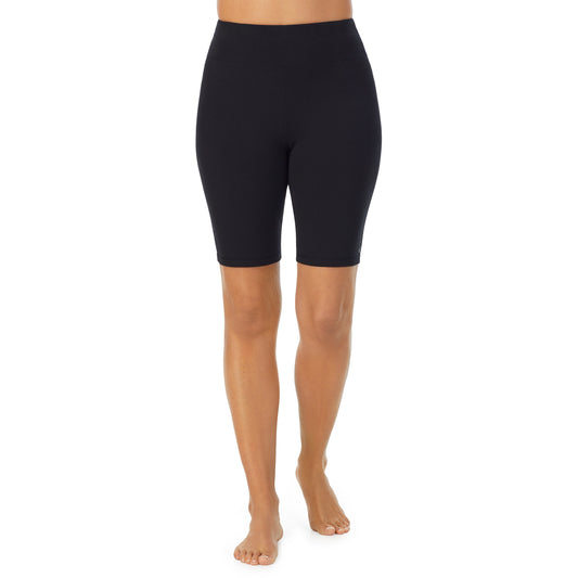 A lady wearing black cottonwear short.