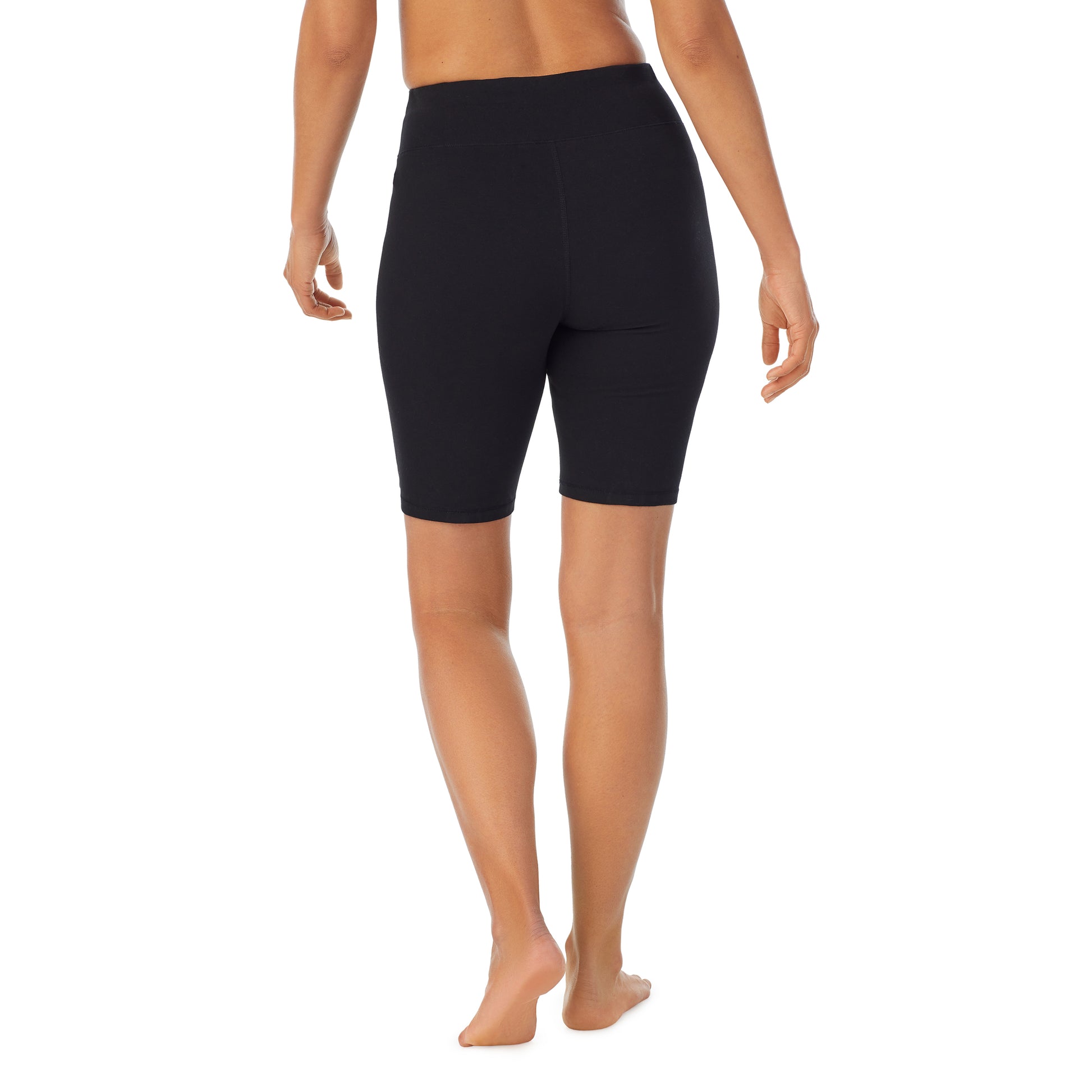 A lady wearing black cottonwear short.
