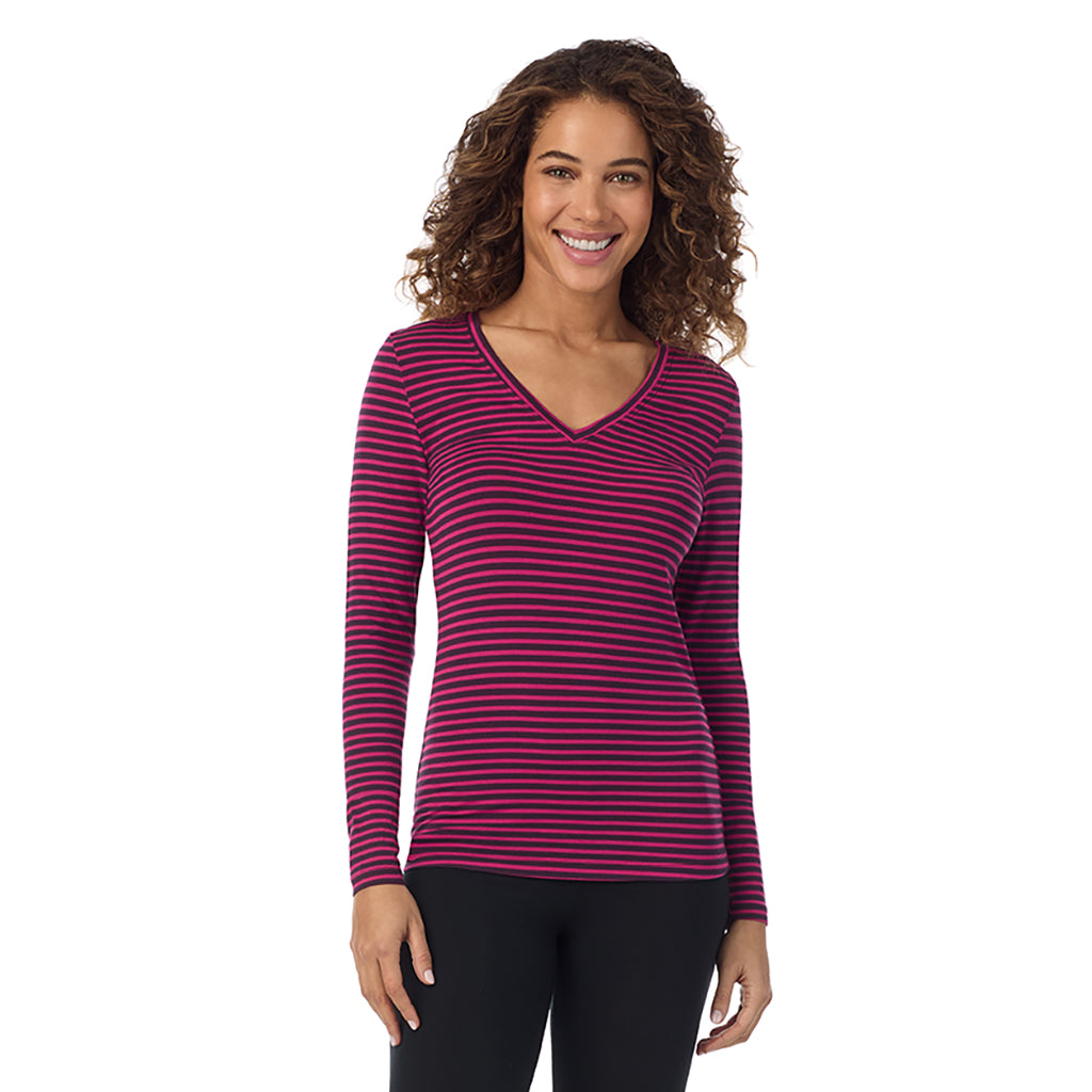 Fuchsia Stripe; Model is wearing size S. She is 5’9”, Bust 34”, Waist 23”, Hips 35”.@A lady wearing fuchsia stripe long sleeve softwear with stretch v-neck.