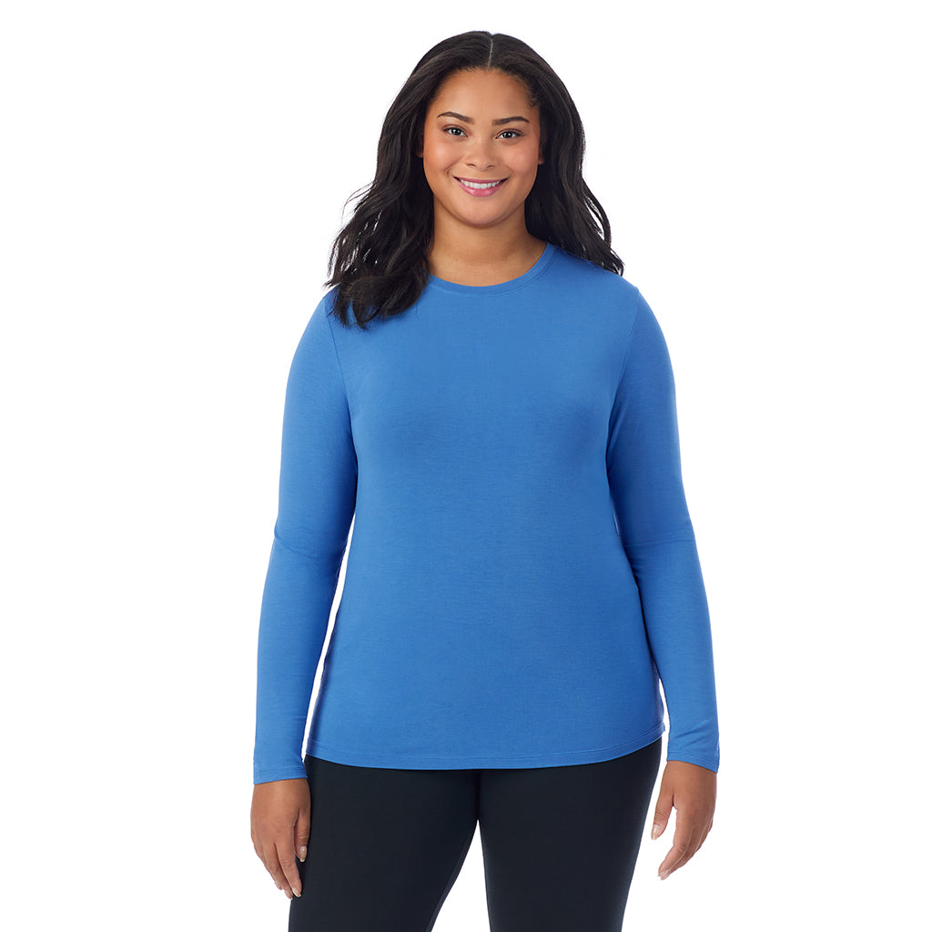 Blue Comet; Model is wearing size 1X. She is 5'11", Bust 36", Waist 36.5", Hips 47.5".@A lady wearing a blue comet long sleeve crew plus.