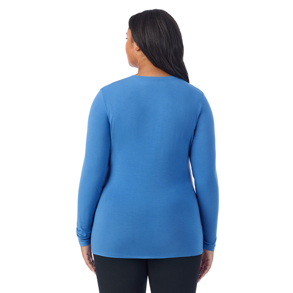 Blue Comet; Model is wearing size 1X. She is 5'11", Bust 36", Waist 36.5", Hips 47.5".@A lady wearing a blue comet long sleeve crew plus.