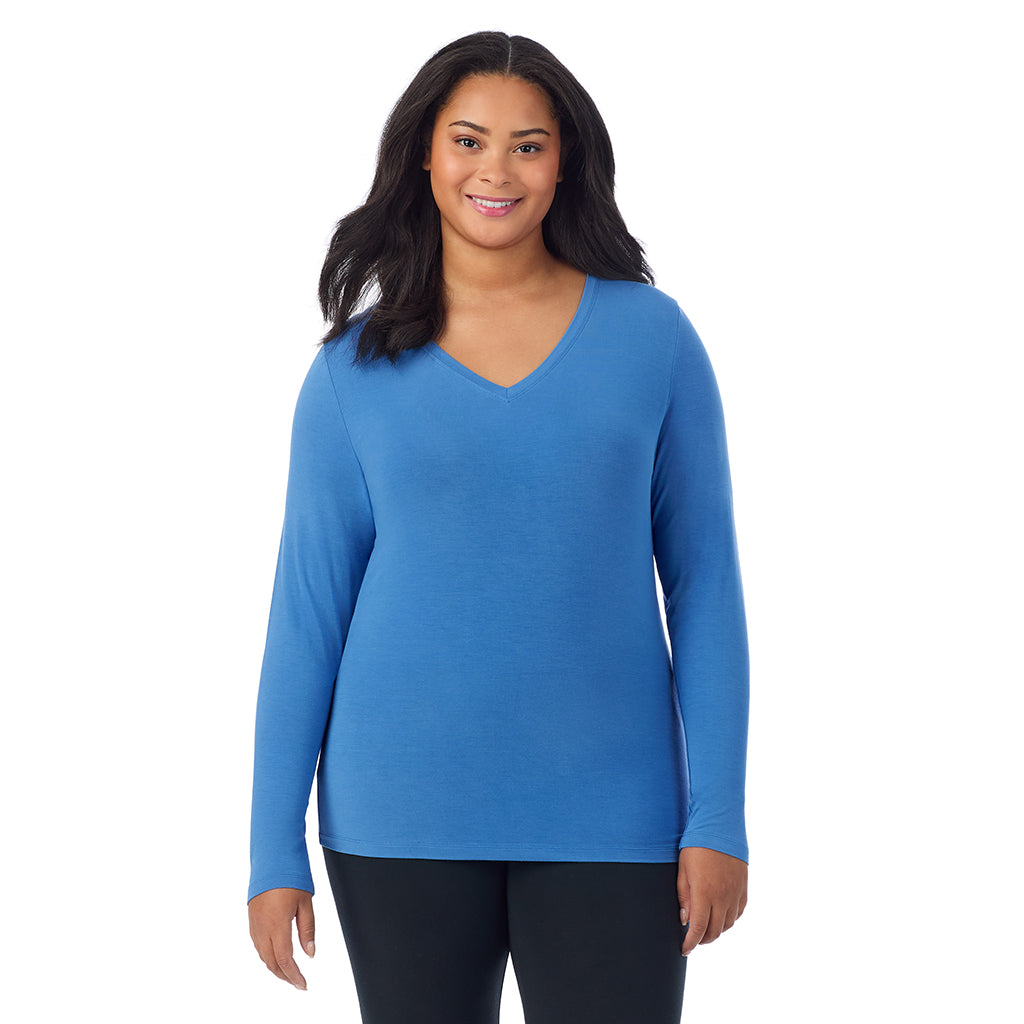 Blue Comet; Model is wearing size 1X. She is 5'11", Bust 36", Waist 36.5", Hips 47.5". @A lady wearing blue comet long sleeve v-neck plus softwer with stretch top.