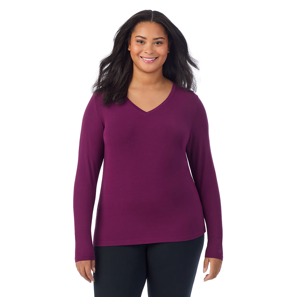 Dark Purple; Model is wearing size 1X. She is 5'11", Bust 36", Waist 36.5", Hips 47.5". @A lady wearing dark purple long sleeve v-neck plus softwer with stretch top.