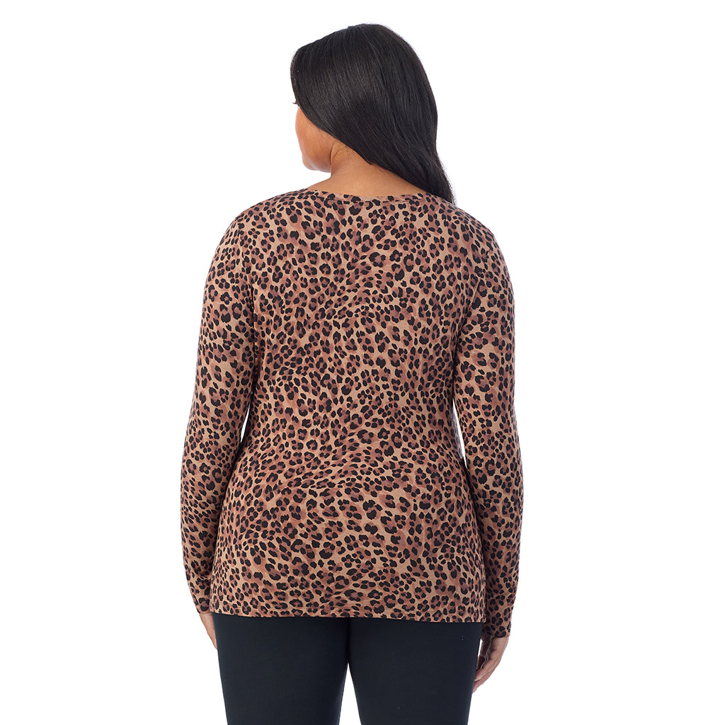 Taupe Leopard; Model is wearing size 1X. She is 5'11", Bust 36", Waist 36.5", Hips 47.5". @A lady wearing taupe leopard long sleeve v-neck plus softwer with stretch top.