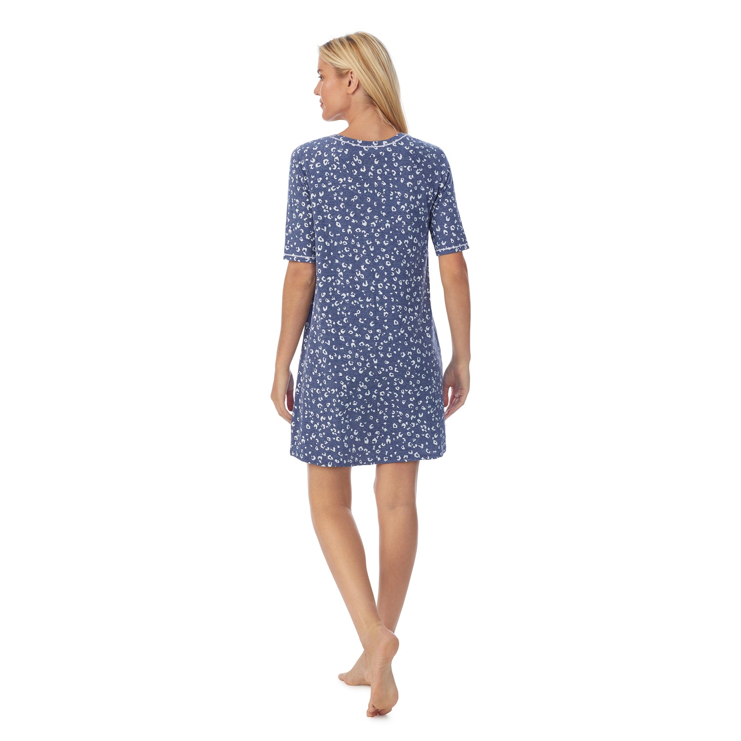 Navy Animal; Model is wearing size S. She is 5'9", Bust 34", Waist 26", Hips 36".@ A lady wearingCuddl Smart Elbow Sleeve Sleep Tee with Navy Animal print