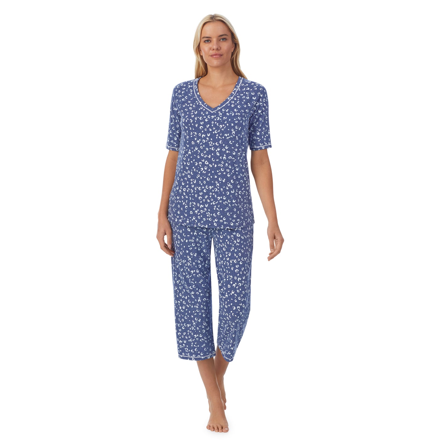Navy Animal;Model is wearing size S. She is 5'9", Bust 34", Waist 26", Hips 36".@ A lady wearingCuddl Smart Elbow Sleeve Top with Cropped Pant Pajama Set with Navy Animal print