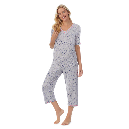  A lady wearingCuddl Smart Elbow Sleeve Top with Cropped Pant Pajama Set with Heather Hearts print