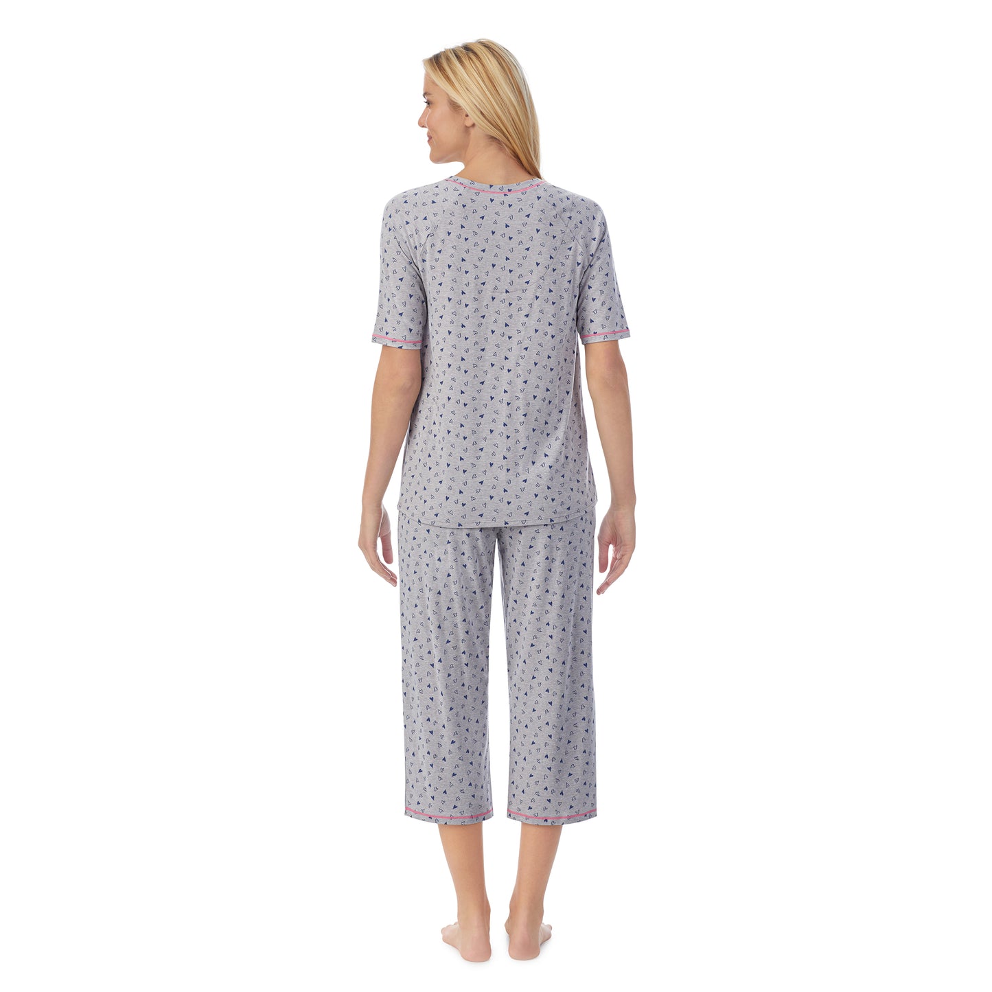 Heather Hearts;Model is wearing size S. She is 5'9", Bust 34", Waist 26", Hips 36".@ A lady wearingCuddl Smart Elbow Sleeve Top with Cropped Pant Pajama Set with Heather Hearts print