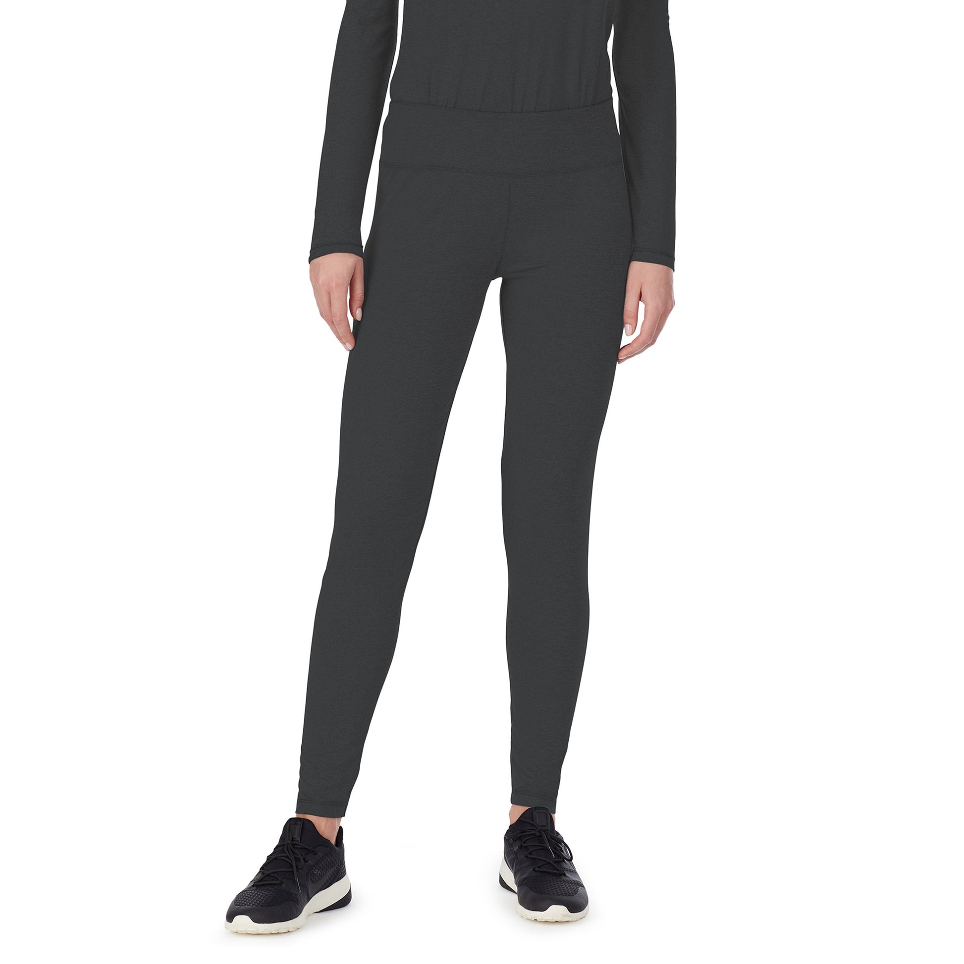 A lady wearing charcoal long sleeve underscrub legging petite.