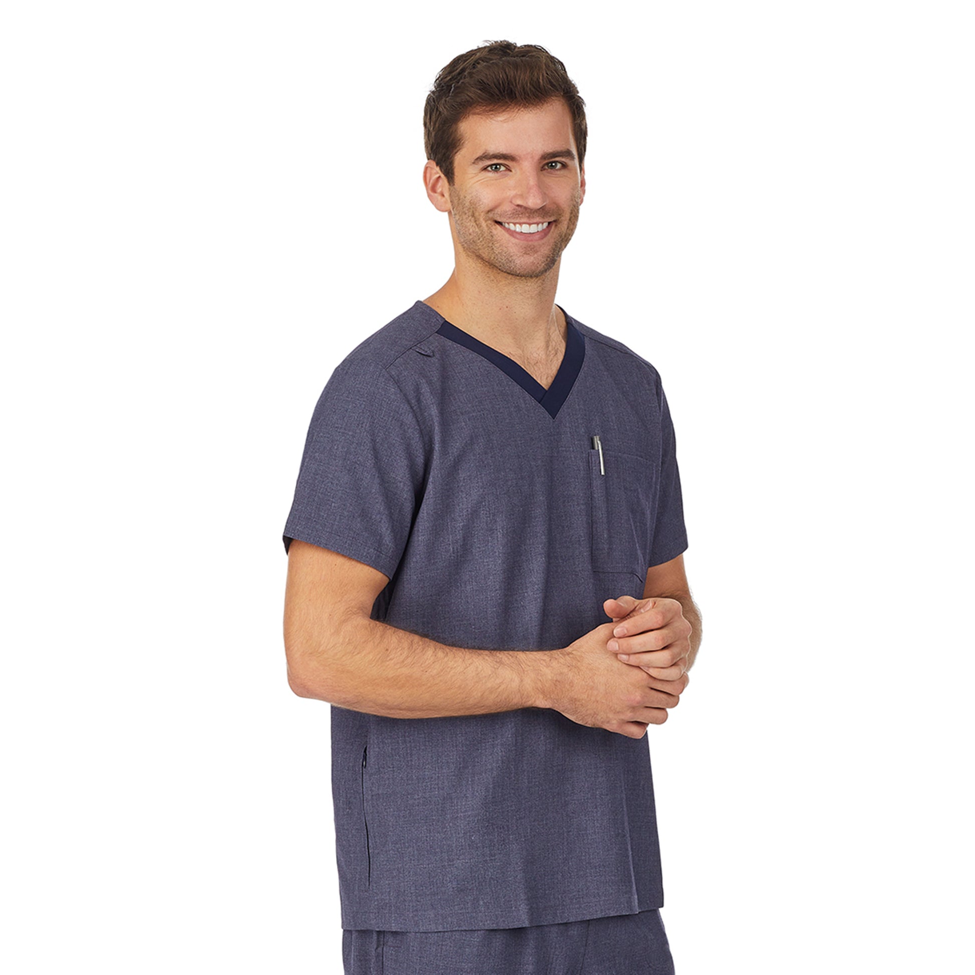 A man wearing navy heather scrub v-neck top with pockets.