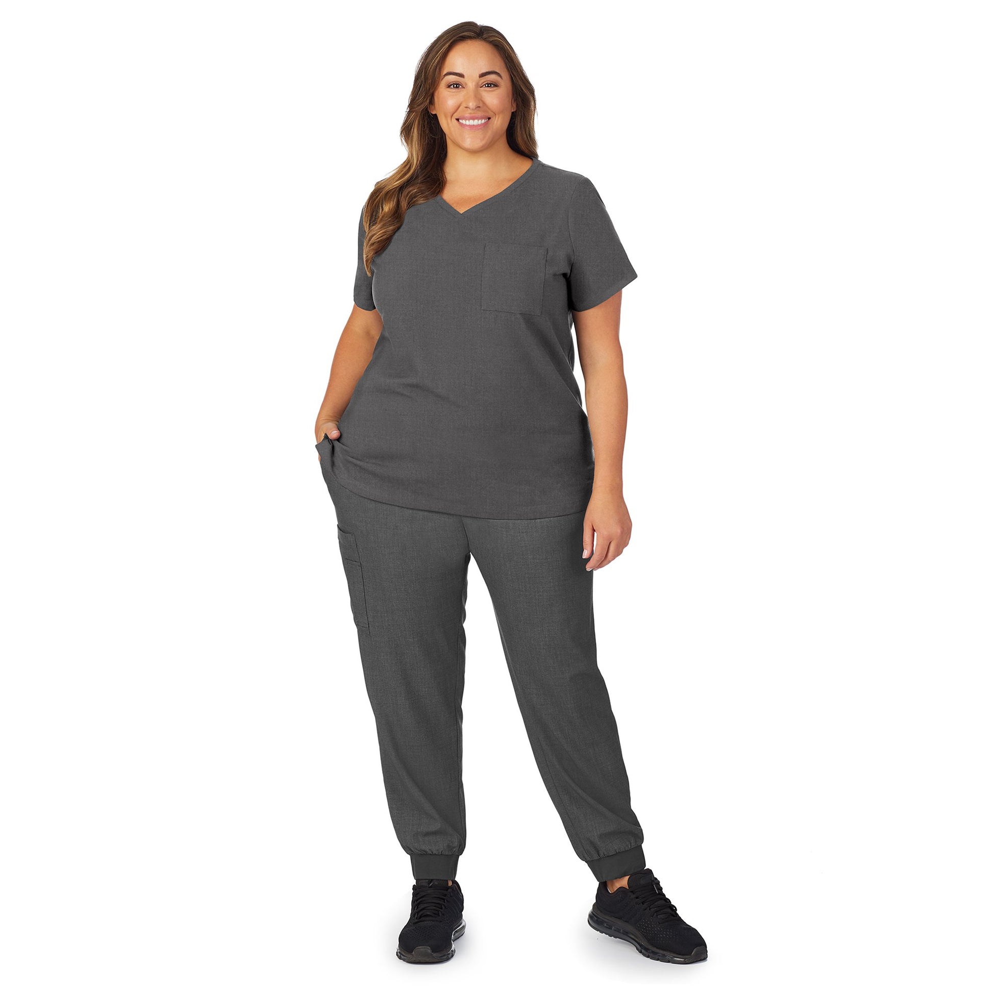 Charcoal Heather;Model is wearing size 1X. She is 5’9.5”, Bust 43”, Waist 37”, Hips 49.5”.@A lady wearing charcoal heather scrub v-neck top with chest pocket plus.