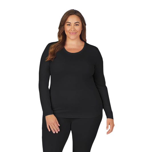 A lady wearing black long sleeve underscrub crew neck top plus.